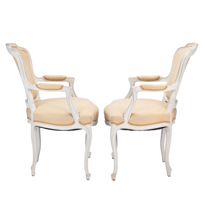 Pair of Louis XVI style painted & upholstered fauteuil (1910-30)
