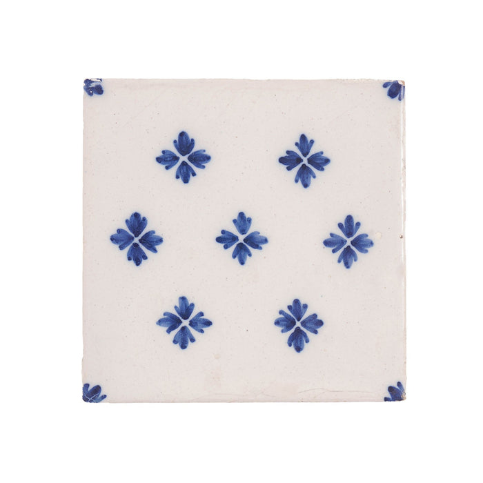 Set of 9 Delft tiles in cobalt pattern of florets (c. 1600’s)