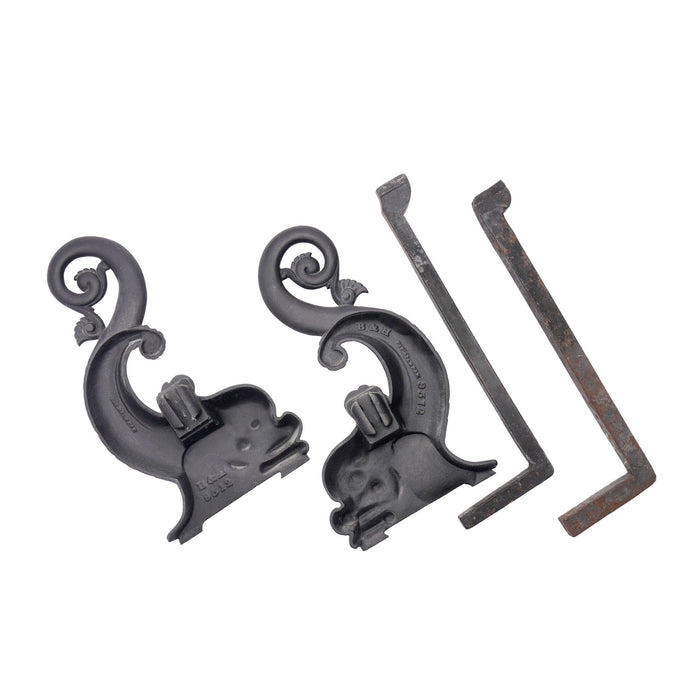 Pair of cast iron dolphin form andirons by Bradley & Hubbard (c. 1900)