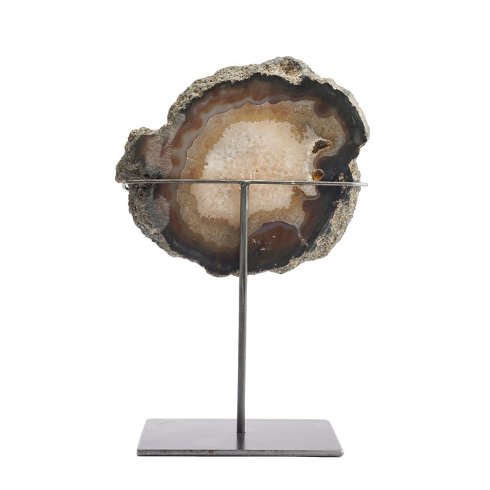 Slice cut agate geode specimen on stand