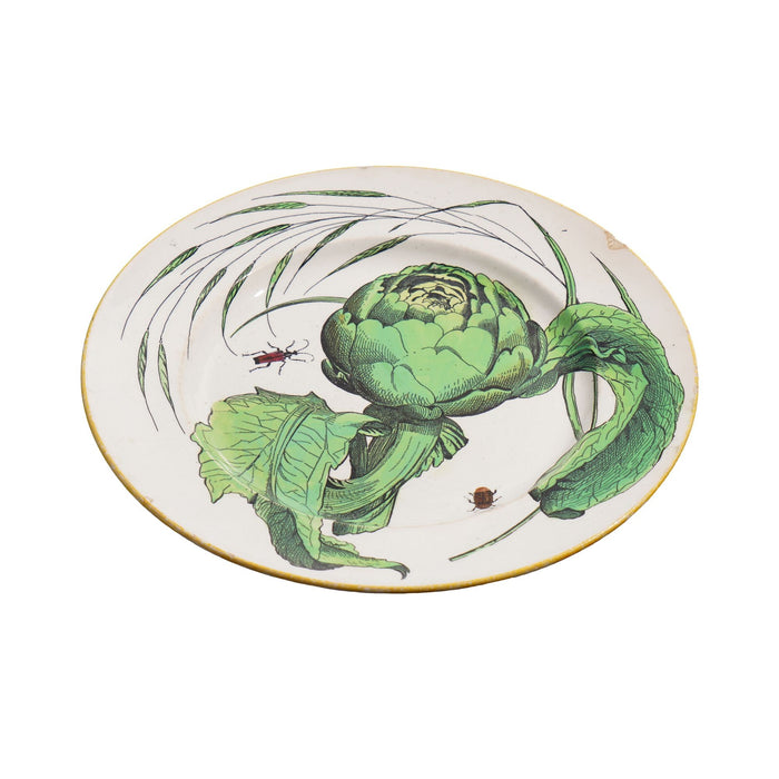 Pair of French glazed faience plates with scallions and artichokes (c. 1850's)