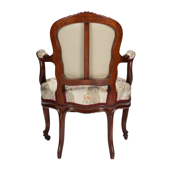 French Louis Philippe Period upholstered walnut arm chair with paired footstool (1850's)