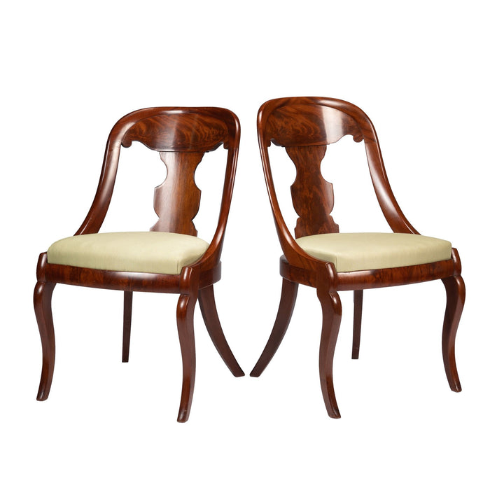 Pair of American mahogany gondola chairs (c. 1815-35)