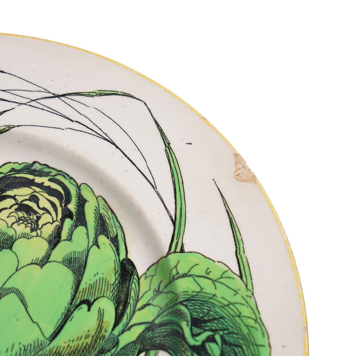 Pair of French glazed faience plates with scallions and artichokes (c. 1850's)
