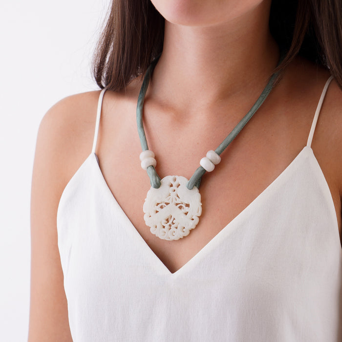 White nephrite jade carved and pierced circular pendant (1800's)