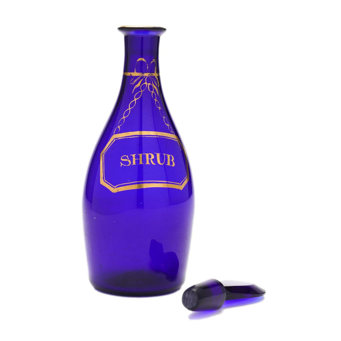 Pair of pyriform blown cobalt blue glass spirit decanters labeled Brandy & Shrub (1790-1810)