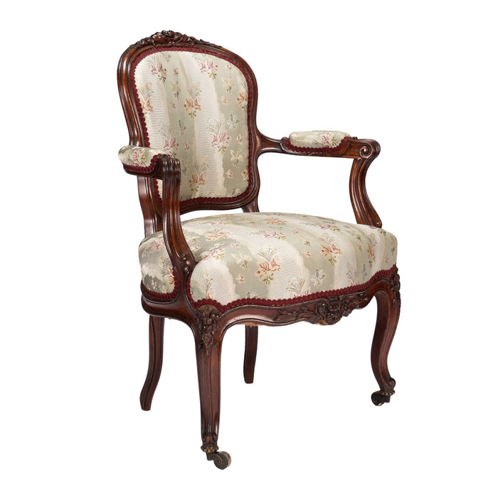French Louis Philippe Period upholstered walnut arm chair with paired footstool (1850's)