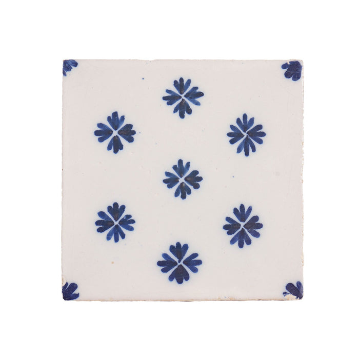 Set of 9 Delft tiles in cobalt pattern of florets (c. 1600’s)