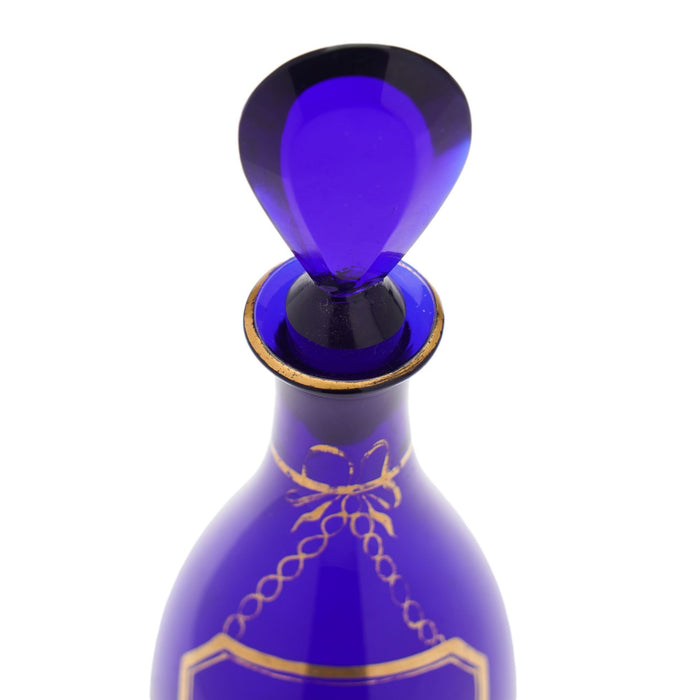 Pair of pyriform blown cobalt blue glass spirit decanters labeled Brandy & Shrub (1790-1810)