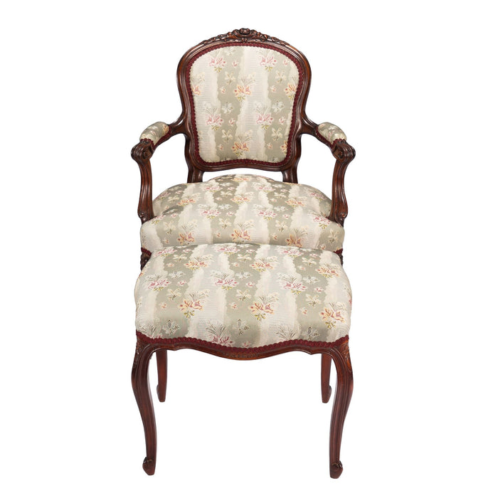 French Louis Philippe Period upholstered walnut arm chair with paired footstool (1850's)