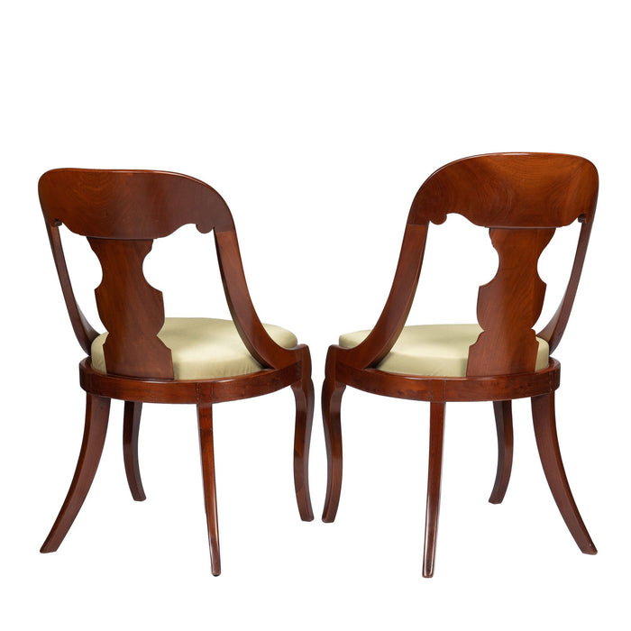 Pair of American mahogany gondola chairs (c. 1815-35)