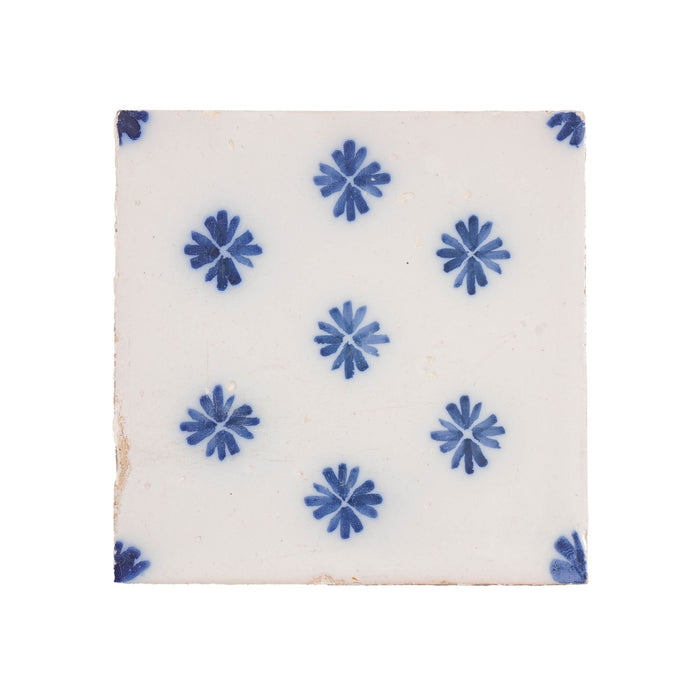 Set of 9 Delft tiles in cobalt pattern of florets (c. 1600’s)