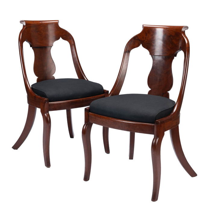 Pair of American mahogany upholstered slip seat gondola chairs (1830-35)