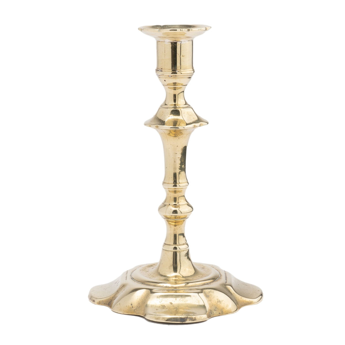 English Queen Anne cast brass petal base candlestick (1750-60
