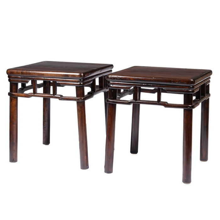 Pair of Chinese Elm stools with hump back rail (c. 1780-1820)