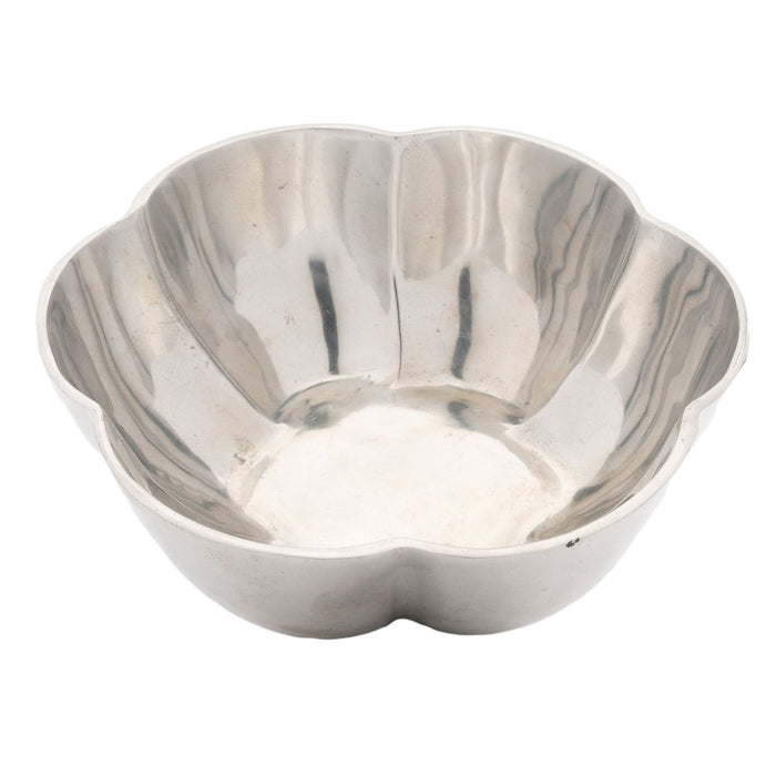 Contemporary cast metal six lobe bowl with flat bottom