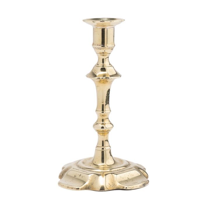 English Queen Anne cast brass petal base candlestick (1750-60)