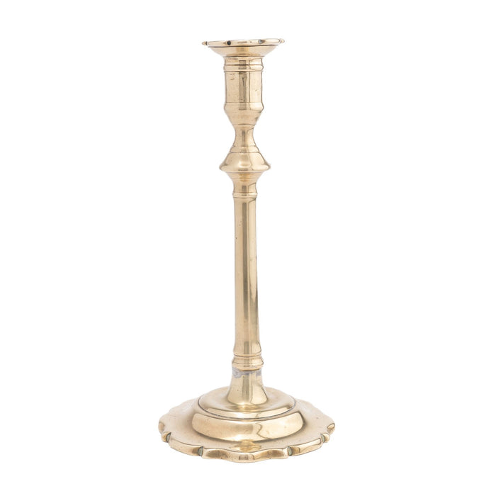 English Queen Anne cast brass candlestick with scalloped base (1780)