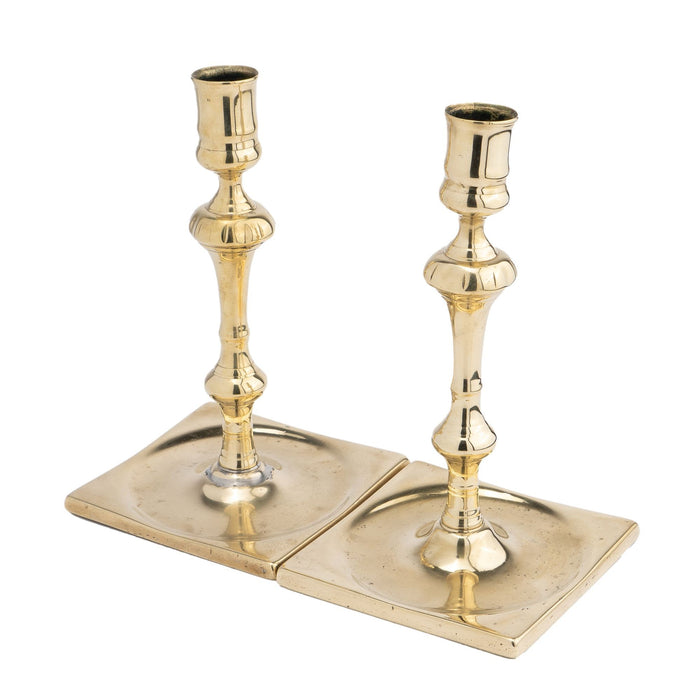 Pair of English silver form cast brass candlesticks (1680-1720)