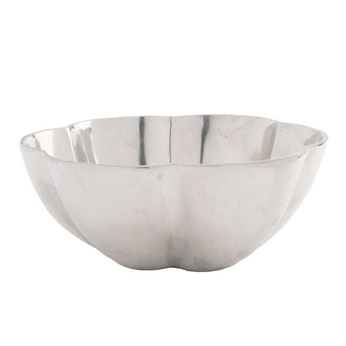 Contemporary cast metal six lobe bowl with flat bottom