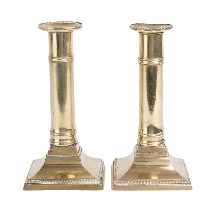 Pair of English cast brass columnar square base candlesticks (c. 1810)