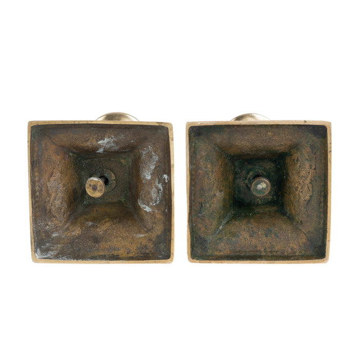 Pair of English cast brass columnar candle sticks on a square base (1810)