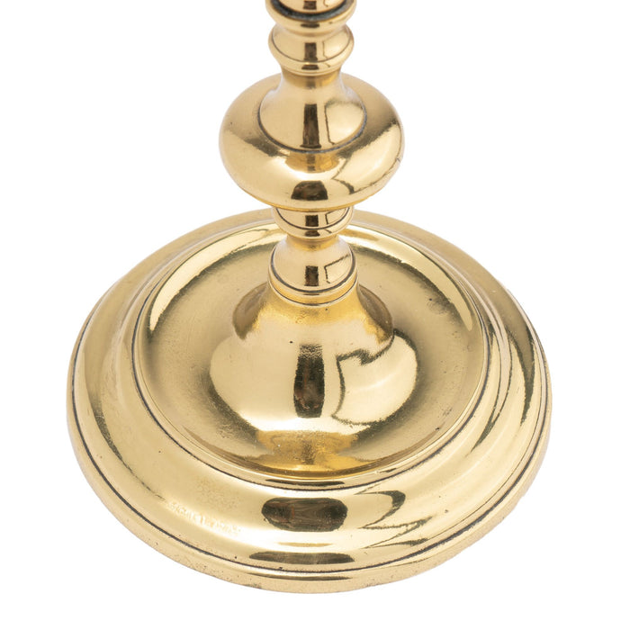 Continental cast brass circular base candlestick (1720-40)