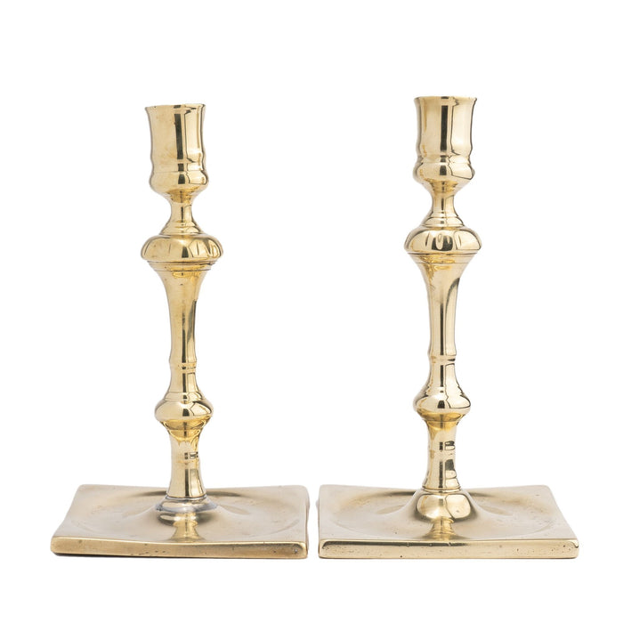 Pair of English silver form cast brass candlesticks (c. 1680-1720)