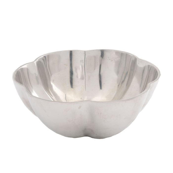 Contemporary cast metal six lobe bowl with flat bottom