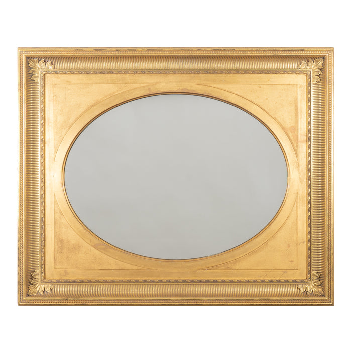 English over mantle mirror with gilt oval reserve in a cove molding