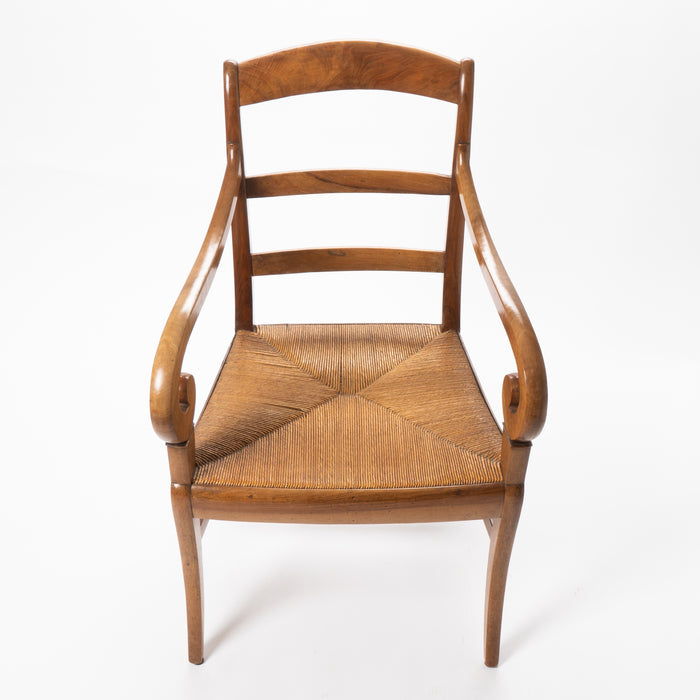 French cherry wood arm chair with rush seat and upholstered seat cushion (c. 1830)