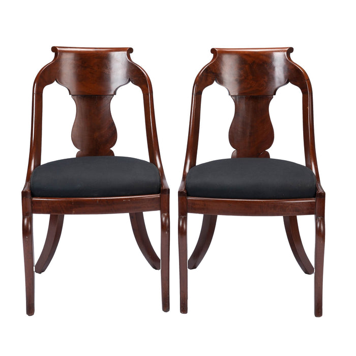 Pair of American mahogany upholstered slip seat gondola chairs (1830-35)