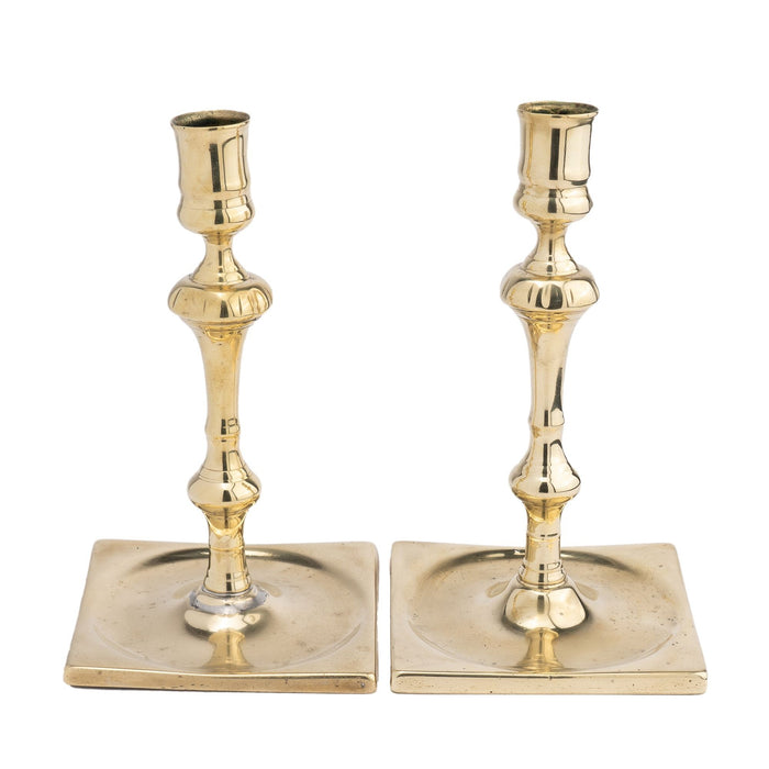 Pair of English silver form cast brass candlesticks (1680-1720)