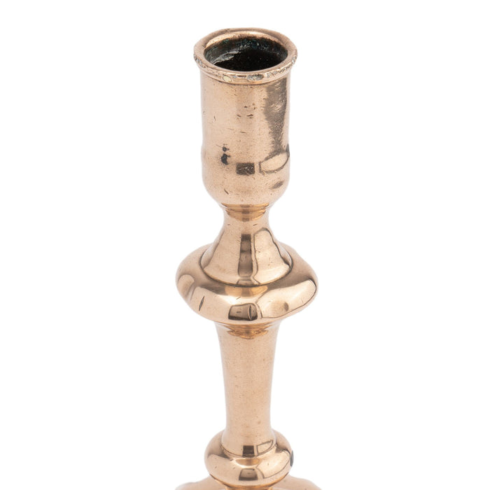 English cast bell metal Queen Anne baluster shaft candlestick (c. 1750-60)