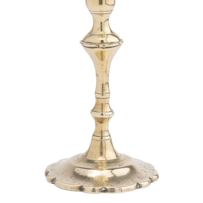 Cast brass Queen Anne petal base candlestick (c. 1760)