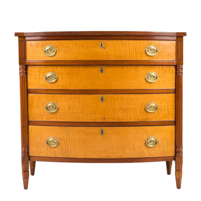 American Sheraton cherry and curly maple four drawer bow front chest (1815)
