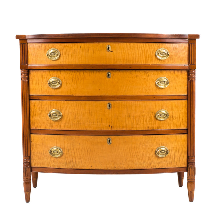 American Sheraton cherry and curly maple four drawer bow front chest (c. 1815)