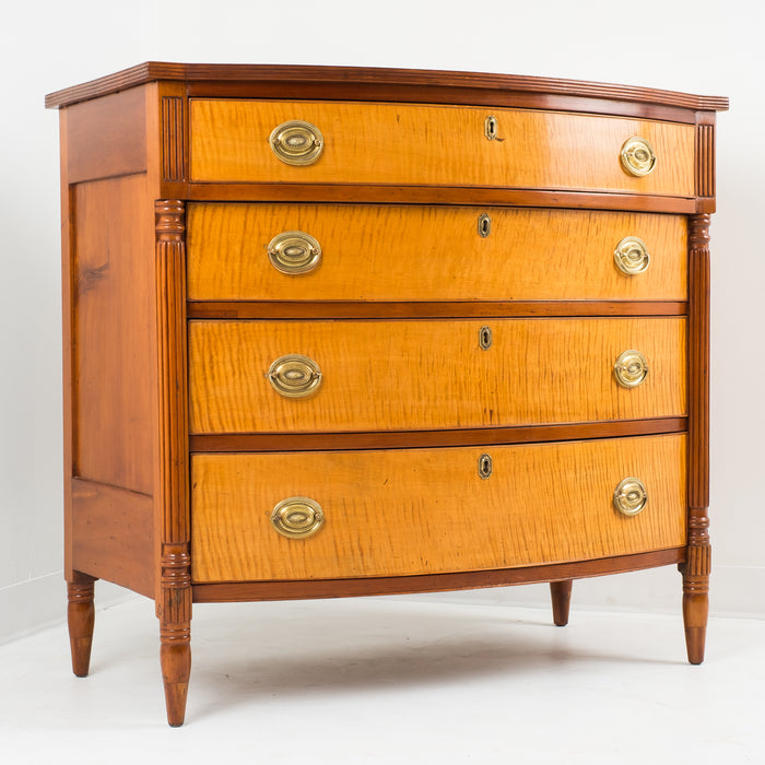 American Sheraton cherry and curly maple four drawer bow front chest (1815)