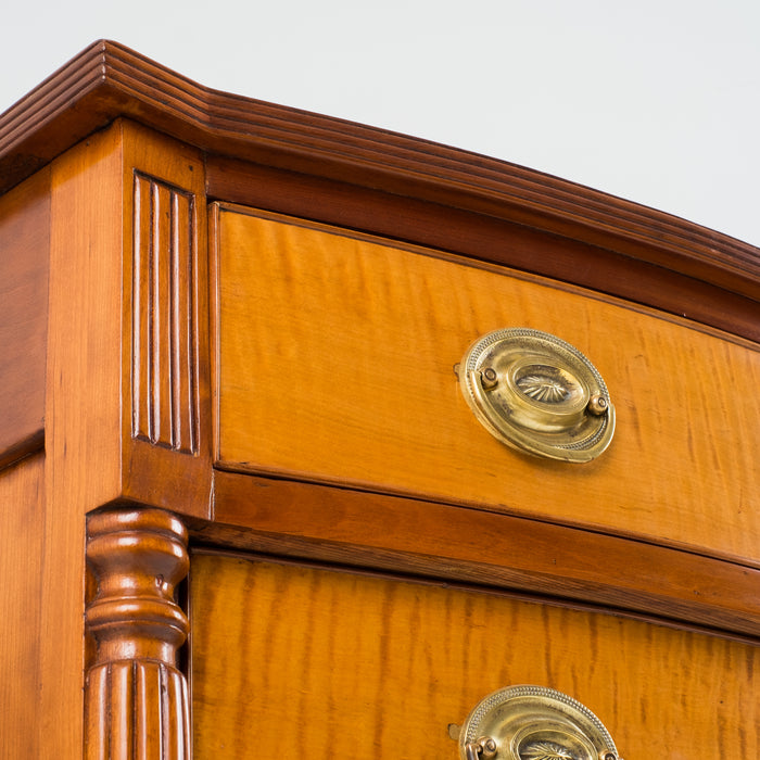 American Sheraton cherry and curly maple four drawer bow front chest (c. 1815)