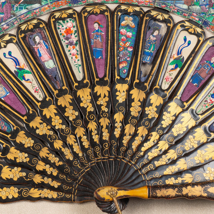 Chinese telescopic fan of gilt decorated black lacquer stays (1850's)