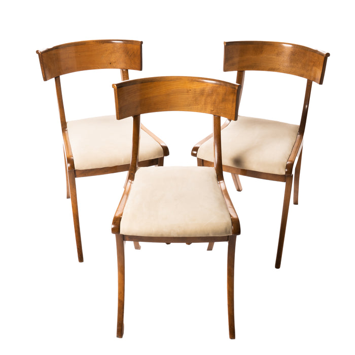 Set of three sabre leg Klismos form side chairs (c. 1820)