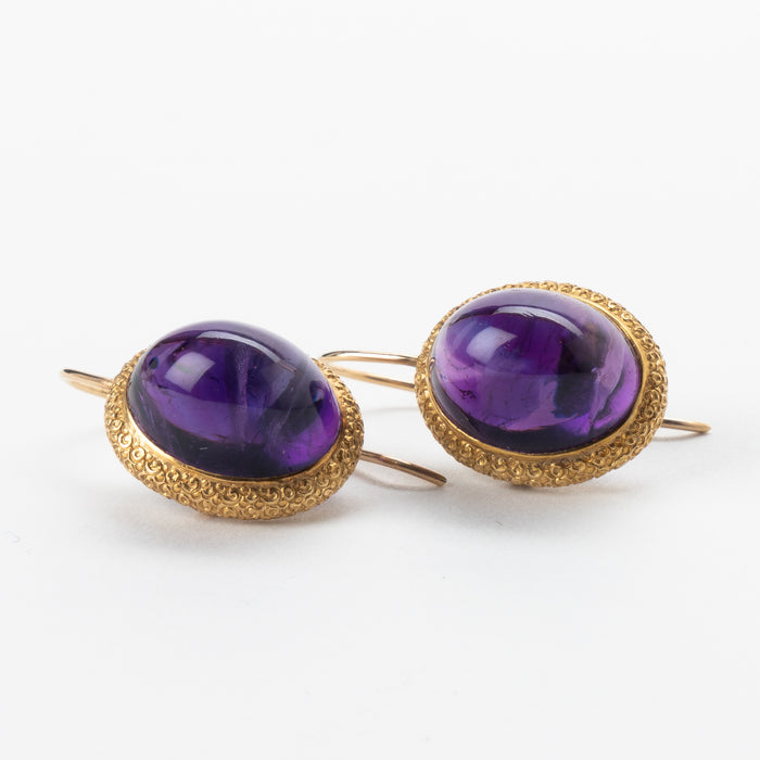 Pair of English cabochon amethyst earrings set in 14k gold engraved bezel (1880)