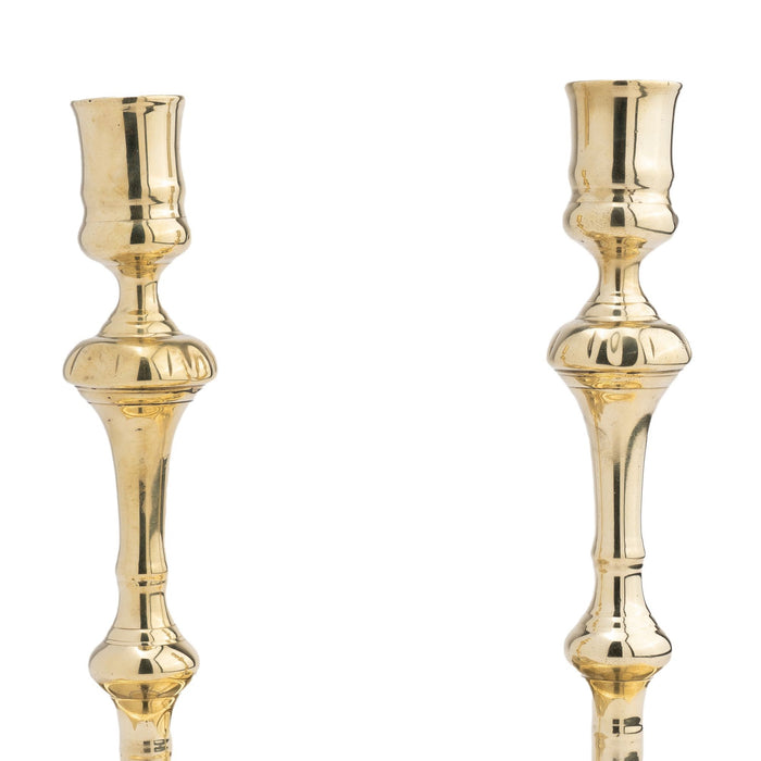 Pair of English silver form cast brass candlesticks (1680-1720)