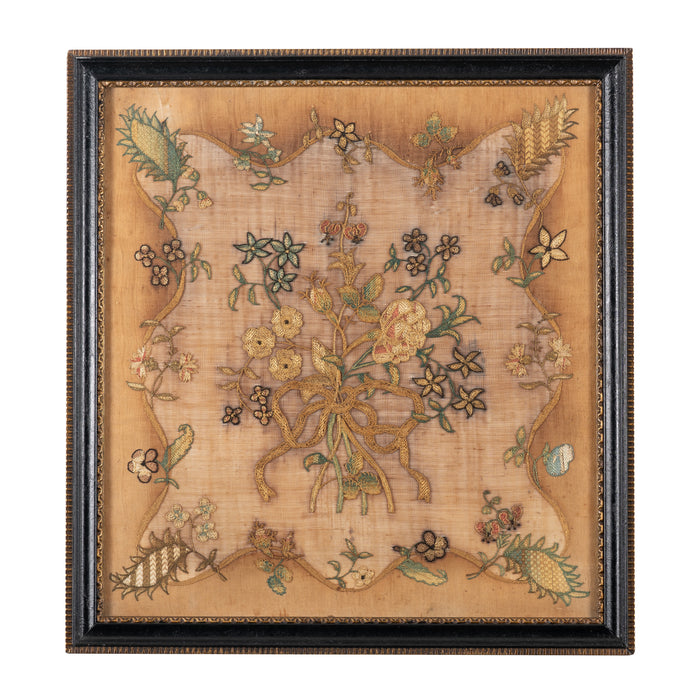 Framed English needlework centering on a floral bouquet (1775-1800)