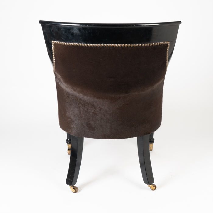 William IV ebonized mahogany framed gondola arm chair in calfskin (1825)