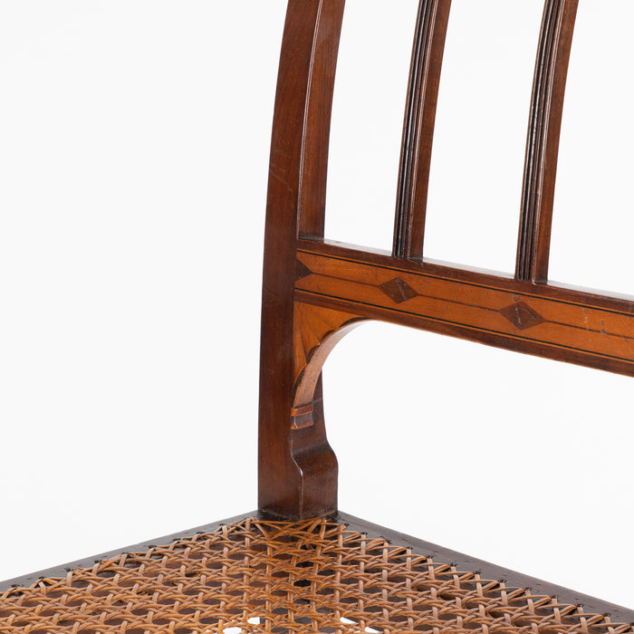Set of four George III cane seat mahogany side chairs (1785)