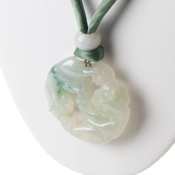 Chinese celadon jade carved and pierced circular pendant necklace (1912-1949)