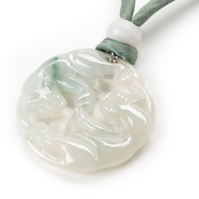 Chinese celadon jade carved and pierced circular pendant necklace (1912-1949)