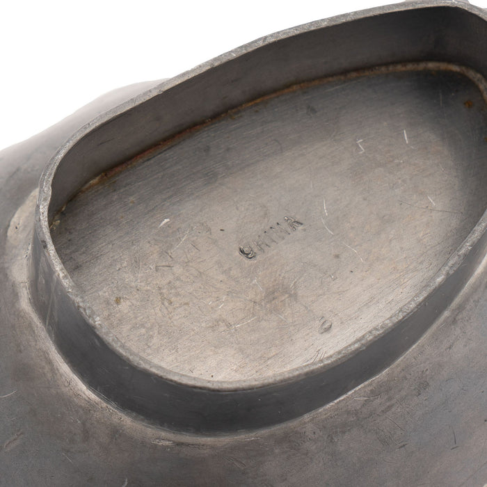 Chinese brass rimmed pewter banana leaf dish on an oval footed base with pewter and jade stem (1900-20)