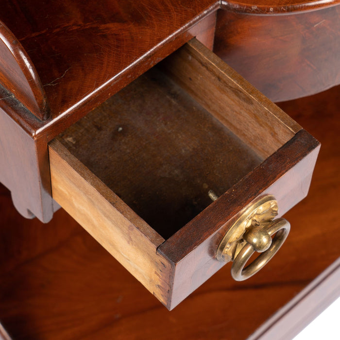 American mahogany demilune dressing stand on brass castors (1830)